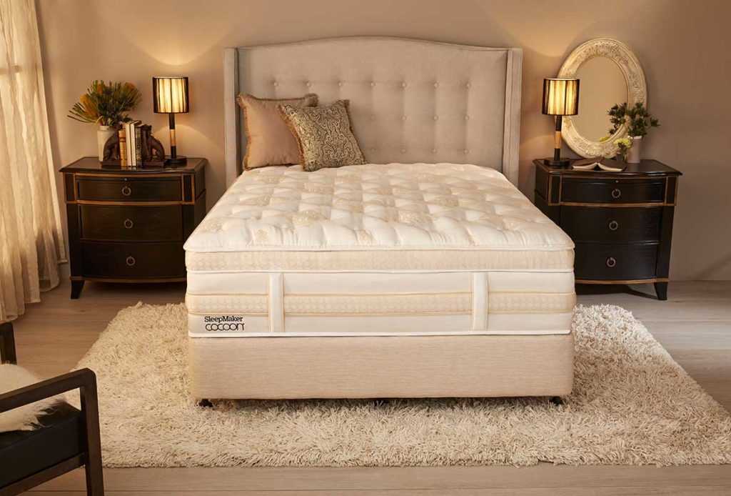 A SleepMaker Cocoon mattress ona bed base in a luxury bedroom