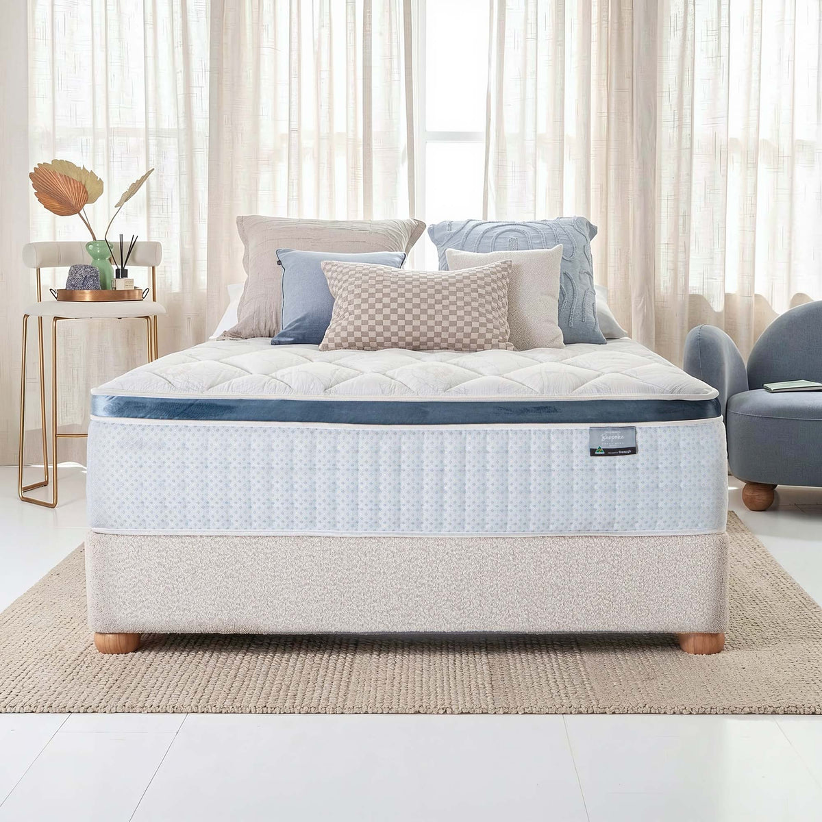 SleepMaker Bespoke mattress with blankets and pillows in a bedroom setting
