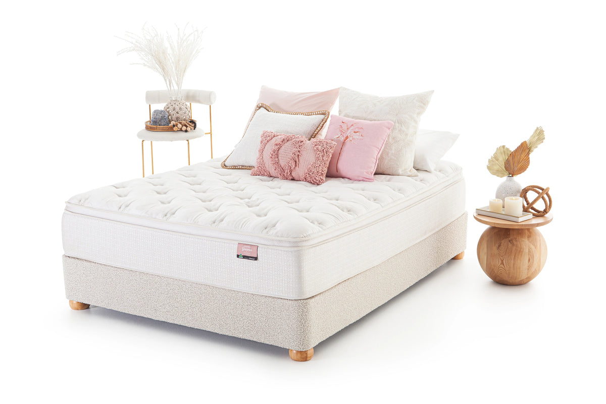 SleepMaker Bespoke mattress with pillows and furniture on a white background