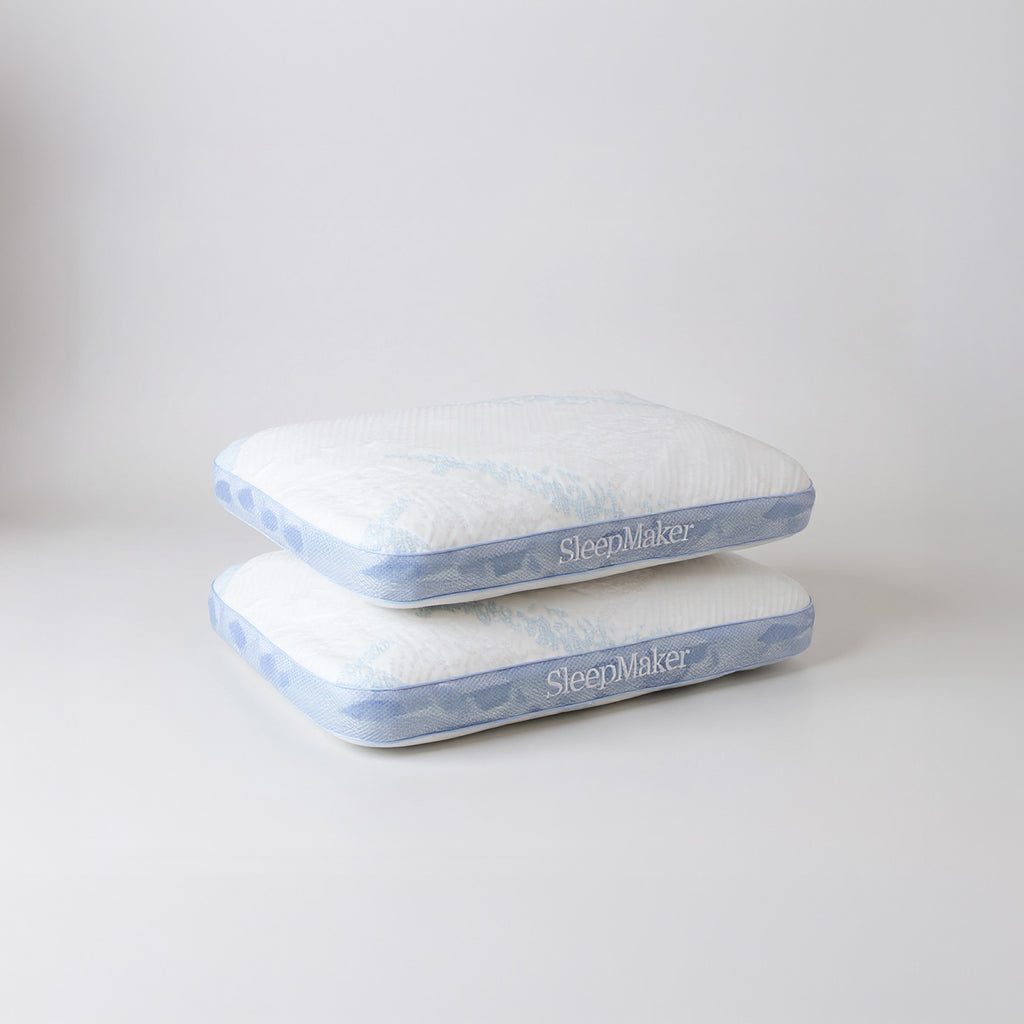 SleepMaker Advanced Collection pillows stacked on a light gray background
