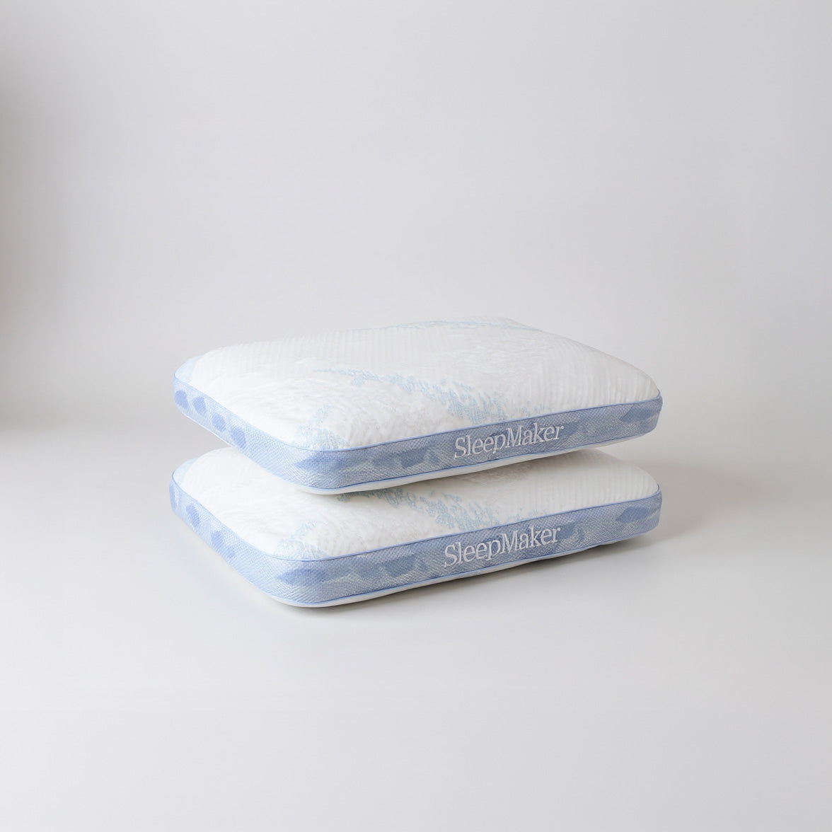 SleepMaker Advanced Collection pillows stacked on a light gray background