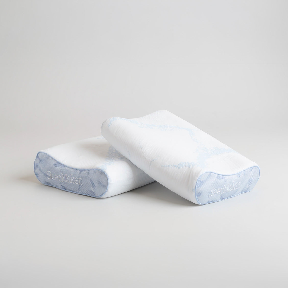 SleepMaker Advanced Collection pillows stacked on a light gray background