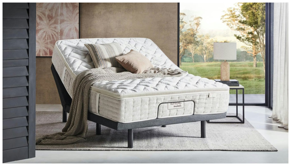 Dunlopillo by SleepMaker mattress sitting on an adjustable bed base in a bedroom setting
