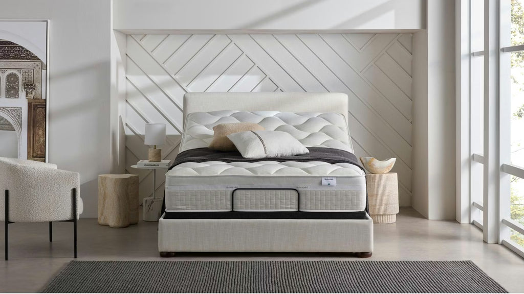 Dunlopillo by SleepMaker mattress sitting on an adjustable bed frame in a bedroom setting
