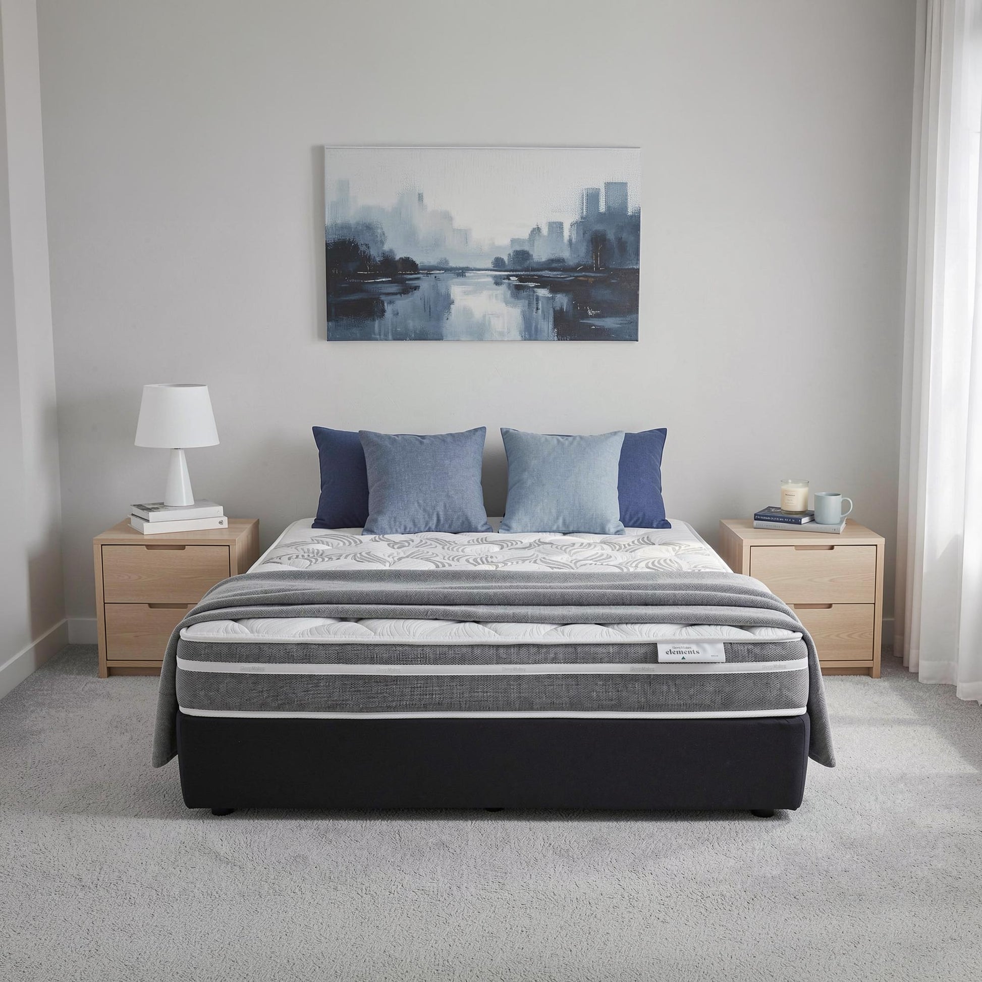 SleepMaker Elements mattress with blankets and pillows in a bedroom setting